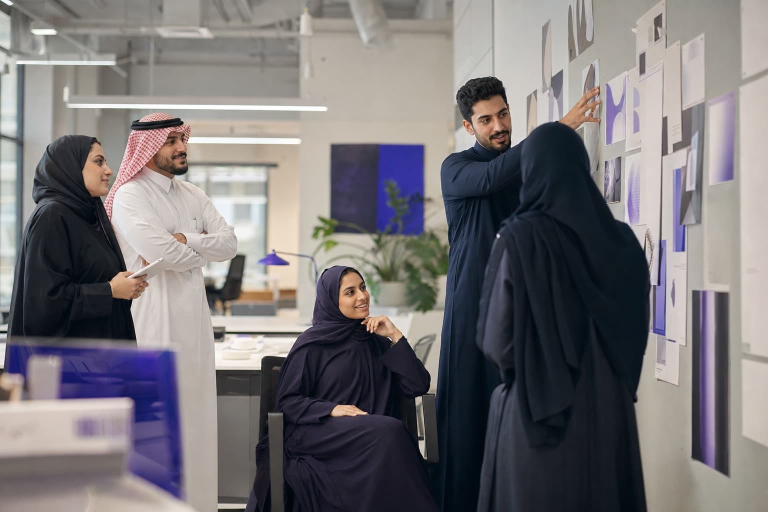 Saudi creative team reviewing work together
